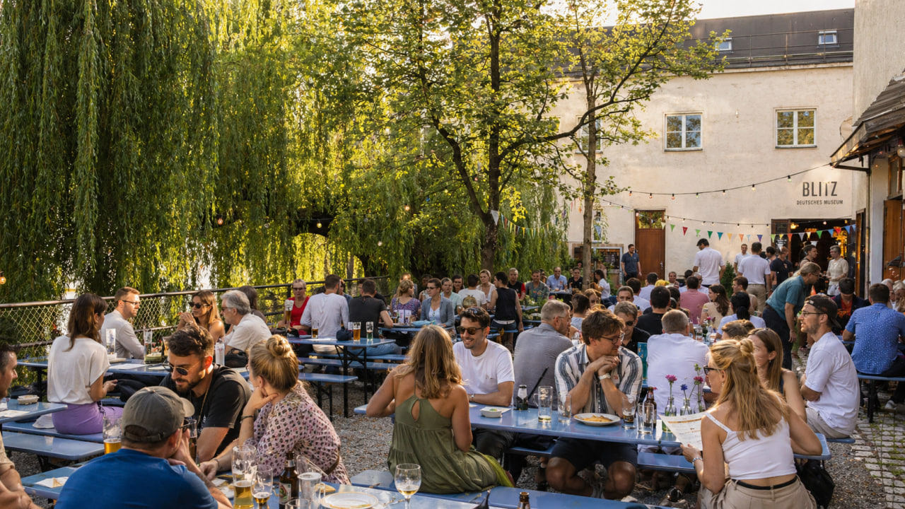 People networking in the BLITZ beer garden on Museum Island beside the Deutsches Museum